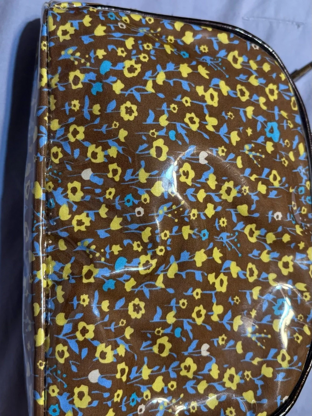 Betsey Johnson Brown Floral Coated Cosmetic Bag with Yellow & Blue Accents